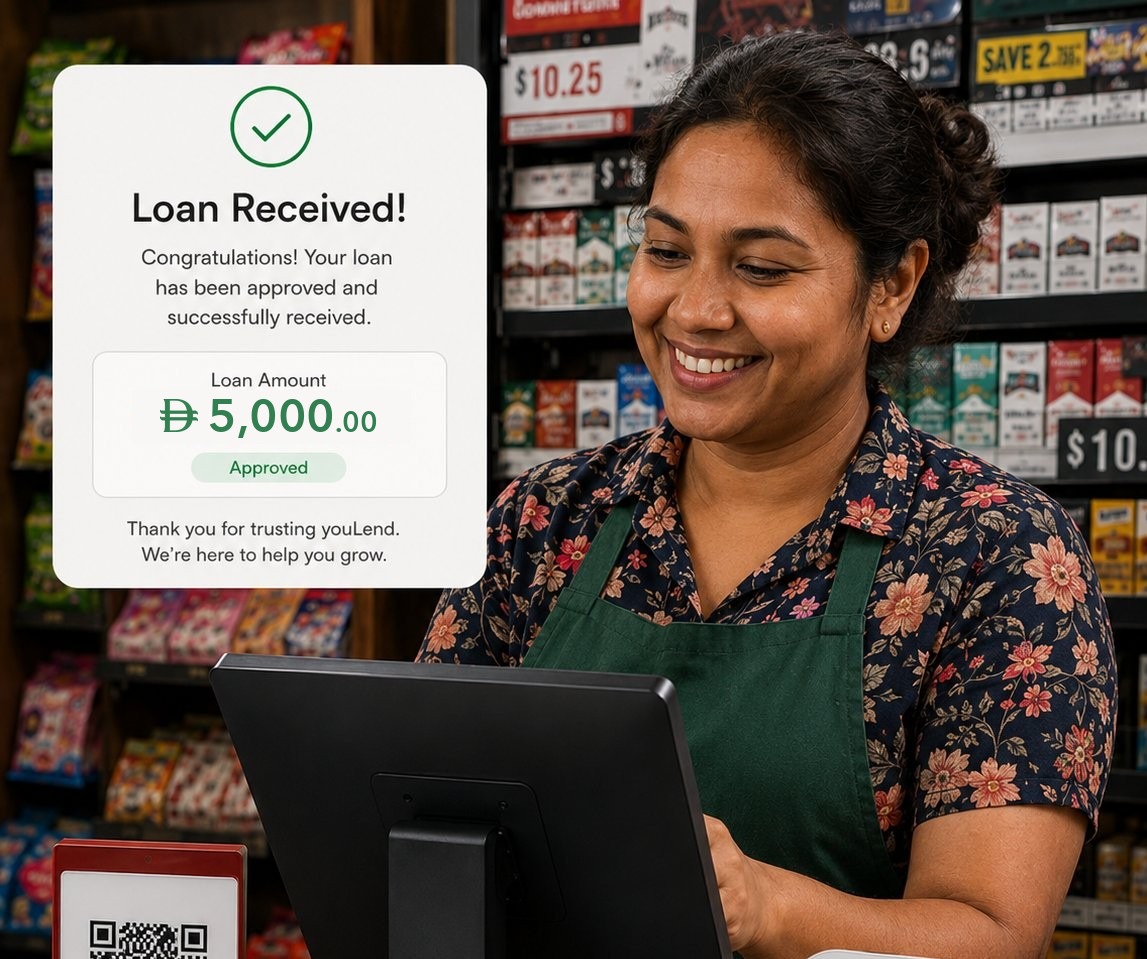 A shop owner smiling at a loan-approved message on her youcloud POS